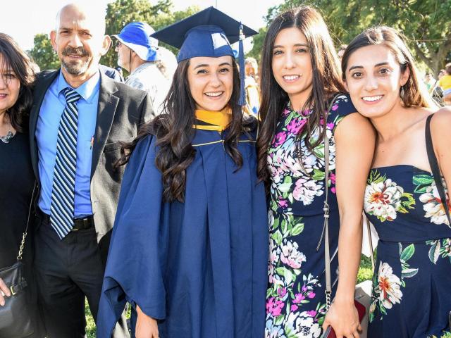 graduate with family at commencement